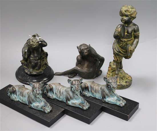 Three lion bookends and three other ornaments